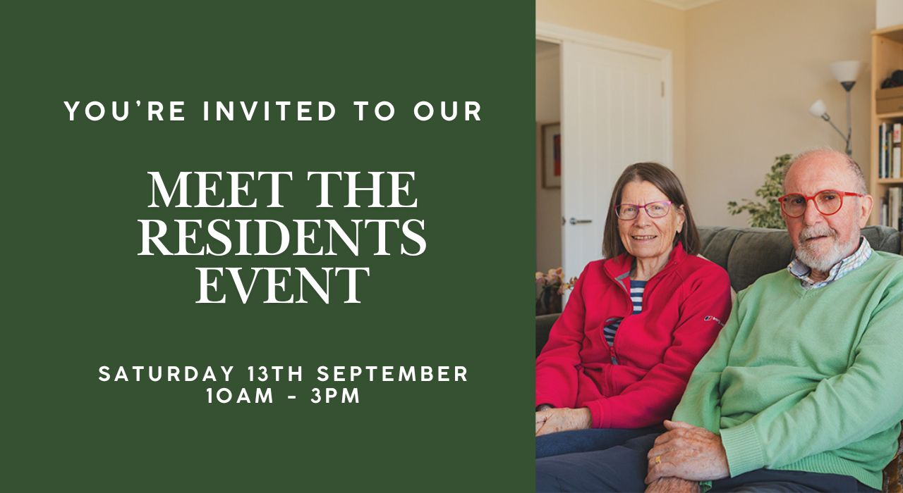 Meet the Residents Event at Burnham Waters: The new retirement village in Essex. Retired couple sat together in the sofa in their bungalow