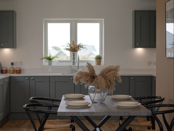 Burnham Waters Sales event - sage green kitchen in new three-bedroom bungalow show home