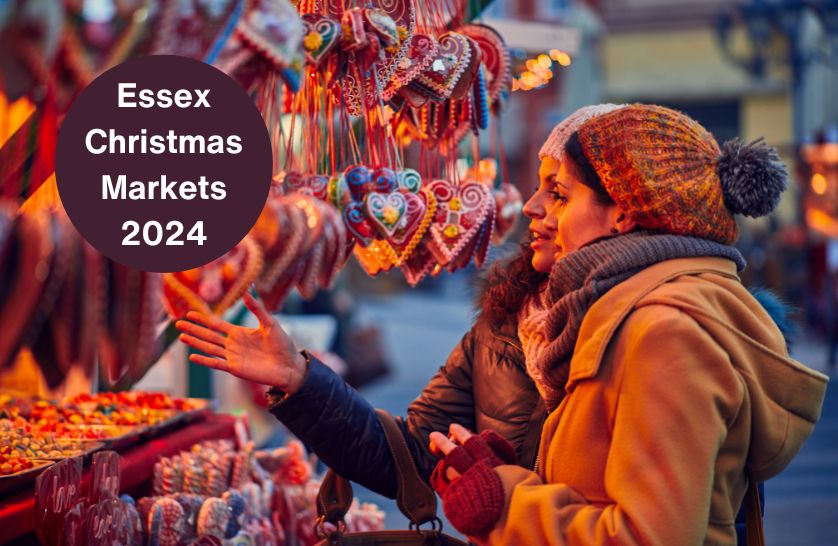 Customers browsing around Christmas market stalls