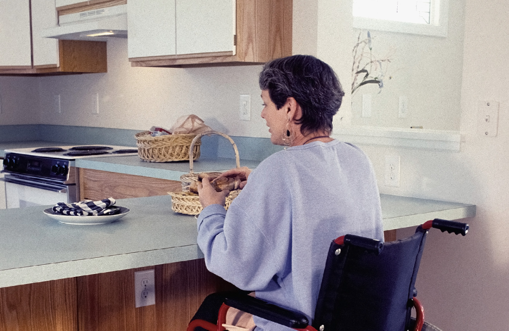 An image of a disabled women benefitting from the facilities retirement villages with bungalows offer.