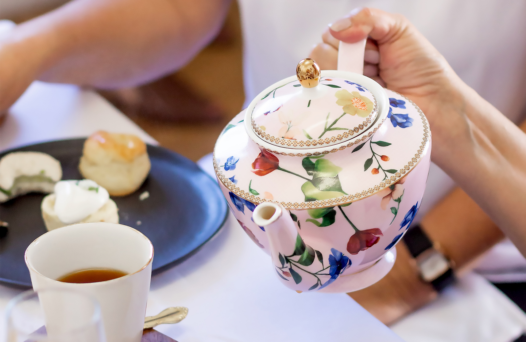 An image of over 50's enjoying a cream tea in Essex, to represent what's on in Essex.