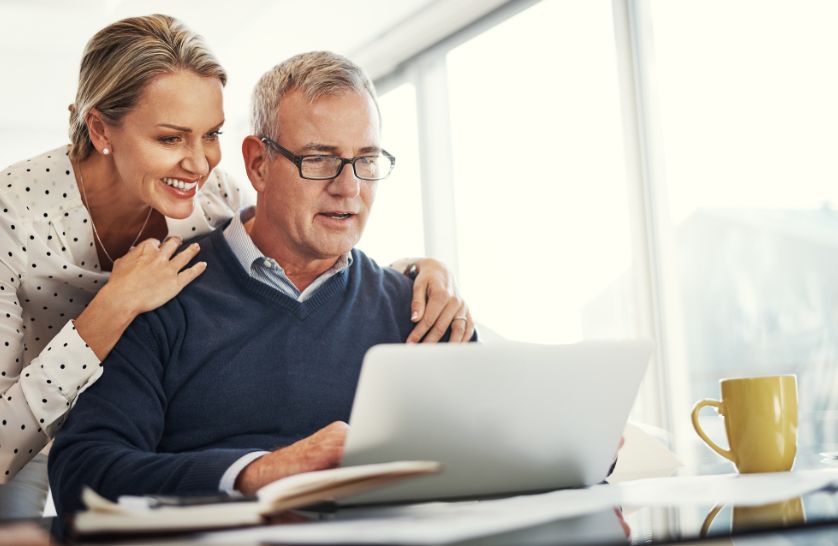 Retired couple researching the benefits of Assisted Move