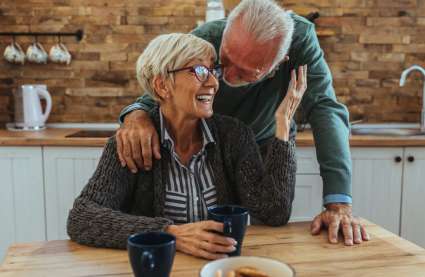 Stamp duty incentive at Burnham Waters_older couple smiling together at table