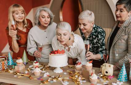 An image of a resident at their 60th birthday party to represent the importance of socialisation in luxury retirement communities