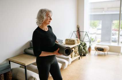An image of a resident at an exercise class at Burnham Waters luxury retirement community.