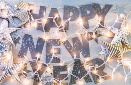 New Year's Eve events near me in Essex 2025 - a local round up - fairly lights strewn across Happy New Year banner