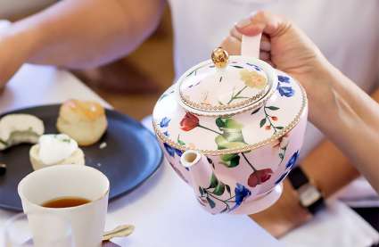 An image of over 50's enjoying a cream tea in Essex, to represent what's on in Essex.